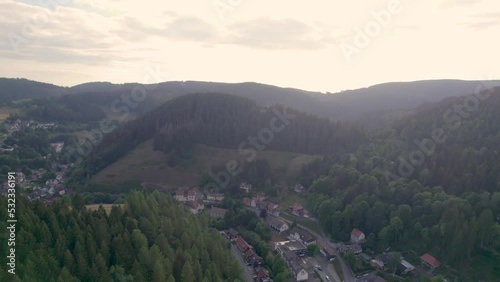 Small German town of Wildemann in the Harz Mountains, drone flight at sunset.  photo