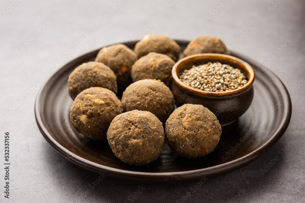 Bajra Atta Ladoo or kuler laddoo - Millet Flour Laddu, a popular winter sweet snack food from India Bajra Atta Ladoo or kuler laddoo - Millet Flour Laddu, a popular winter sweet snack food from India