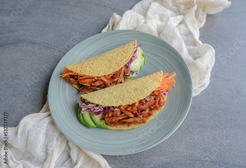 Homemade healthy snacks. Vegan Pulled Pork Taco Fold with Mixed Fruits Basket. Good for between meals snack, made from jackfruit flesh as pork, bbq sauce, purple cabbage, carrots taco shell