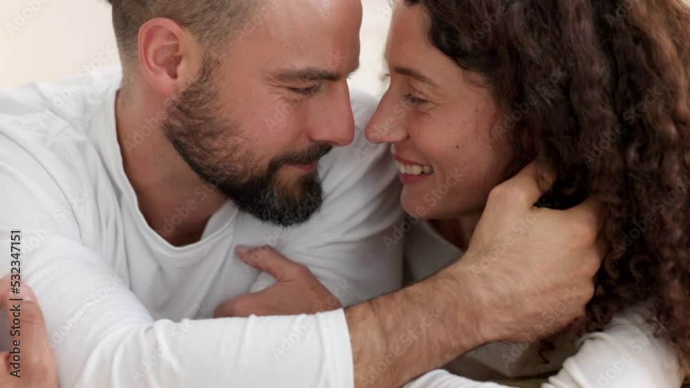 Happy couple, hug in home bedroom and young man love to kiss beautiful supportive woman. Partners smile on date in touch embrace, relationship marriage trust and happiness relaxing intimate together Happy couple, hug in home bedroom and young man love to kiss beautiful supportive woman. Partners smile on date in touch embrace, relationship marriage trust and happiness relaxing intimate together