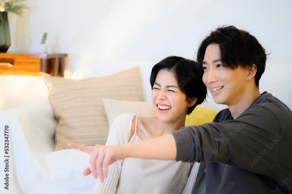 Couples relaxing at night watching videos, TV, etc. Couples relaxing at night watching videos, TV, etc.