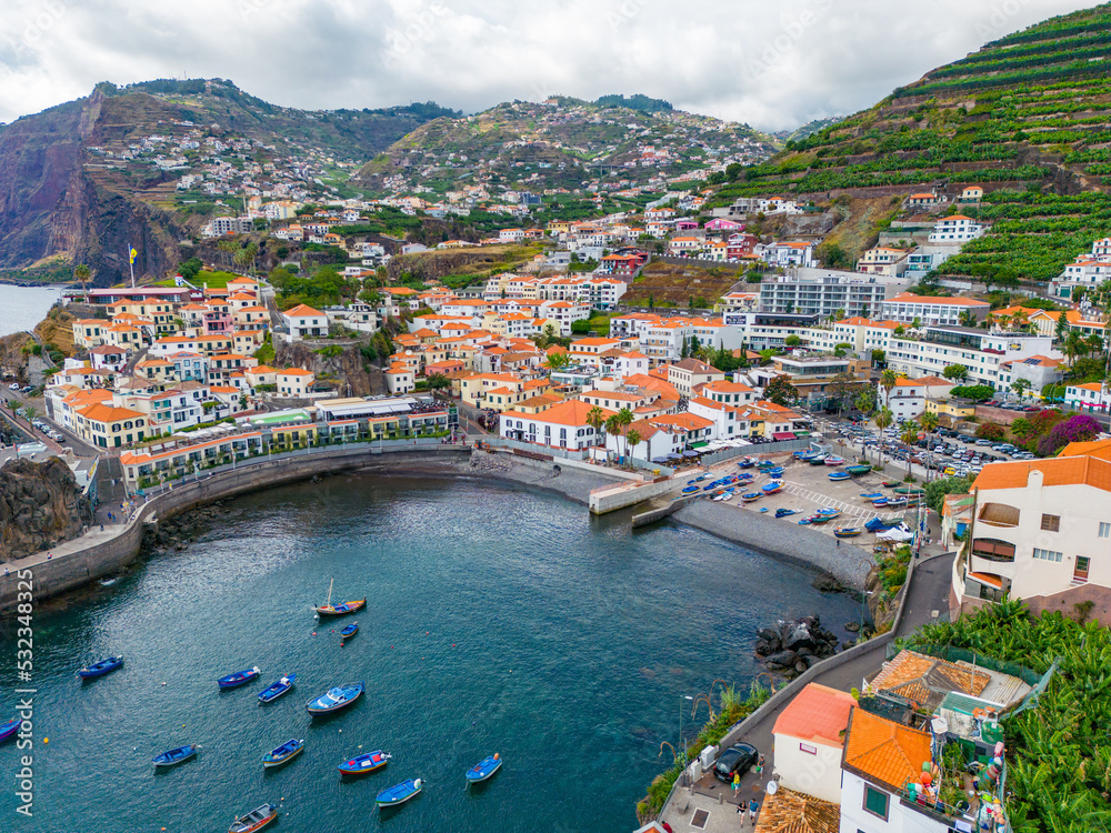 Madeira. Camara de Lobos Aerial View. Small fisherman village with many small boats in a bay. Madeira Island, Portugal.