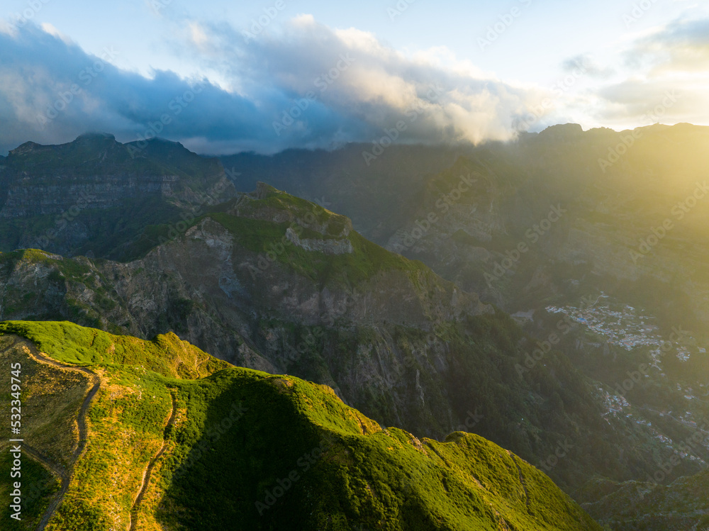 Madeira Island Aerial View. Scenic View During Sunrise. Green Mountains and Cloudy Sky. Portugal. Europe.