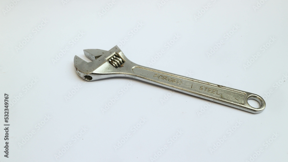 Old adjustable wrench isolated over white Old adjustable wrench isolated over white