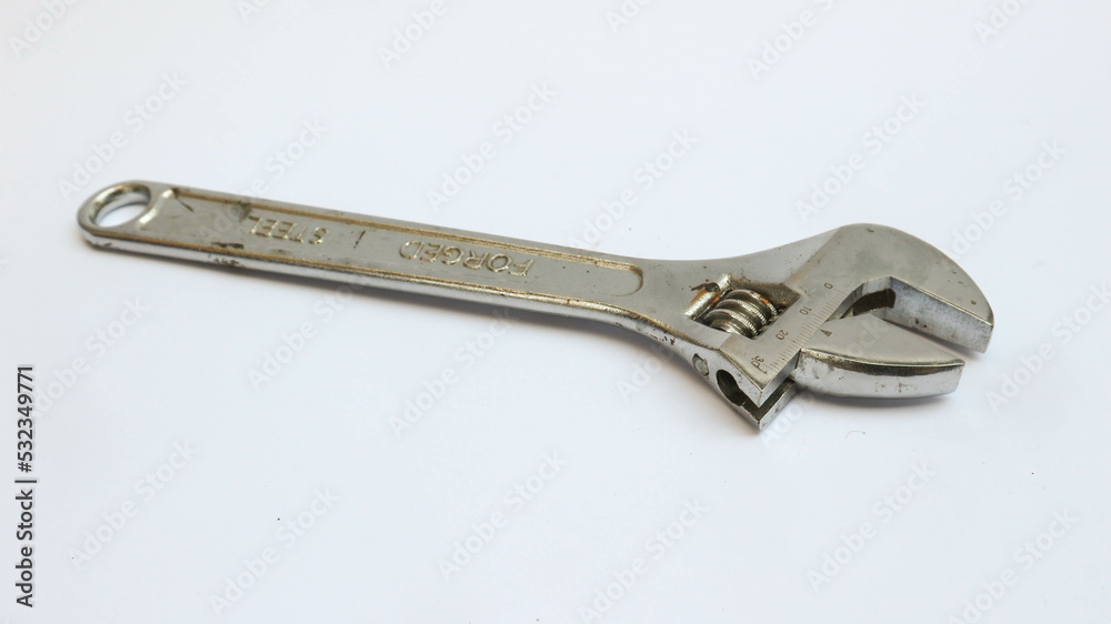 Old adjustable wrench isolated over white Old adjustable wrench isolated over white