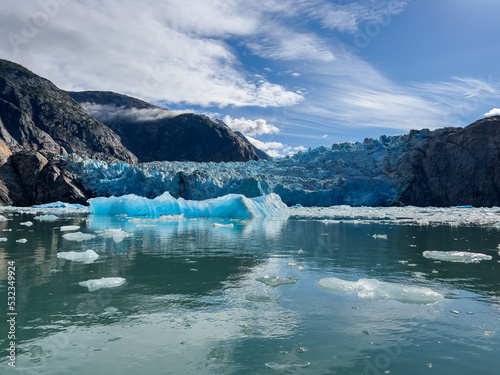 Ice berg floating near the face of South Sawyer Glacier in South East Alaska photo