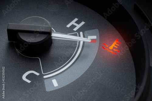 Pointer at the high temp point of the temperature gauge in the vehicle radiator and the symbol has the red light is on