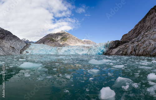Chunks of ice float near the face of Dawes Glacier in Endicott Arm as seen from the water level