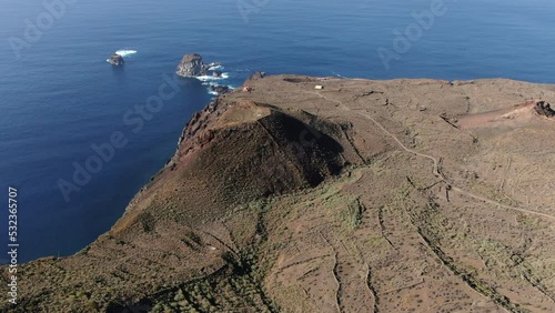 fantastic aerial shot in orbit over volcanoes of El Hierro and in the background you can see the beautiful Roque de Salmor, on the island of El Hierro, Canary Islands. photo