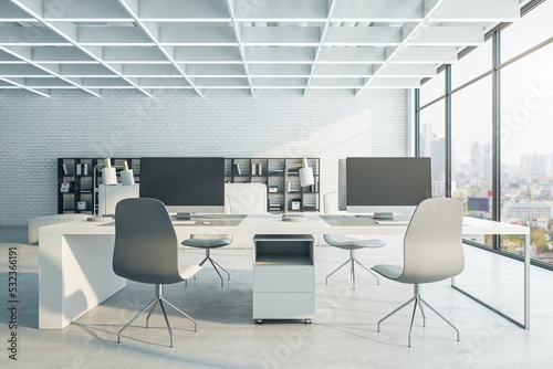 Bright concrete coworking office interior with furniture, equipment and window with city view, daylight. 3D Rendering. © Who is Danny