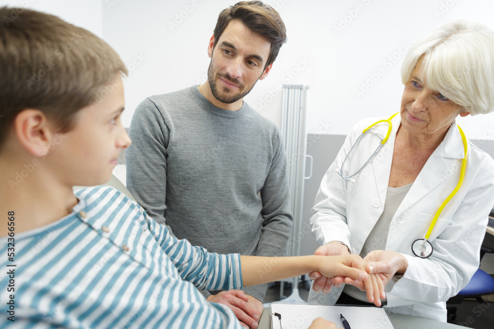 beautiful female doctor examining smiling child in office beautiful female doctor examining smiling child in office