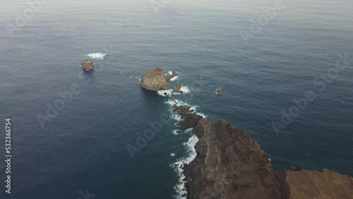 aerial shot forward over the Roque de Salmor, on the island of El Hierro, Canary Islands. photo
