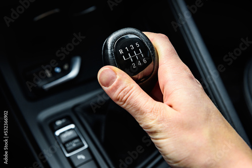 Fotografie Driver shifting the gear on car manual gearbox.
