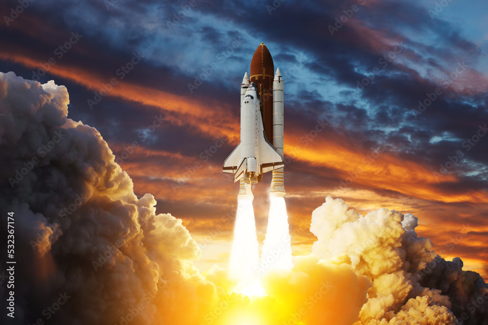 Spaceship lift off. Space shuttle with smoke and blast takes off into space on a background of sunset. Successful start of a space mission. Elements of this image furnished by NASA. - obrazy, fototapety, plakaty 