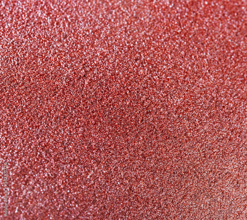 matte grungy sandpaper background closeup matte grungy sandpaper background closeup