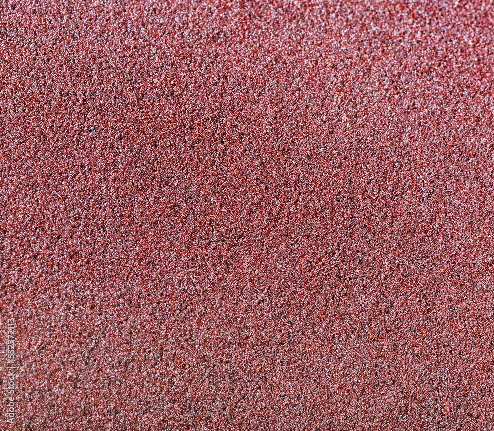 Fototapeta premium matte grungy sandpaper background closeup
