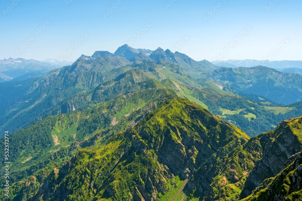 Fototapeta premium Mountain range with gorges and peaks extending into the distance of the horizon.