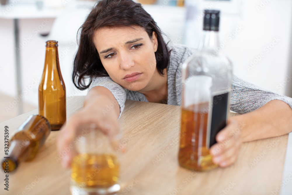young beautiful woman in depression drinking alcohol young beautiful woman in depression drinking alcohol