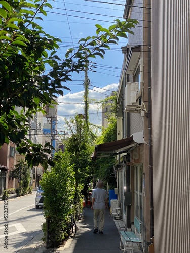 Narrow sidewalk of street in Tokyo downtown “Nezu”, year 2022