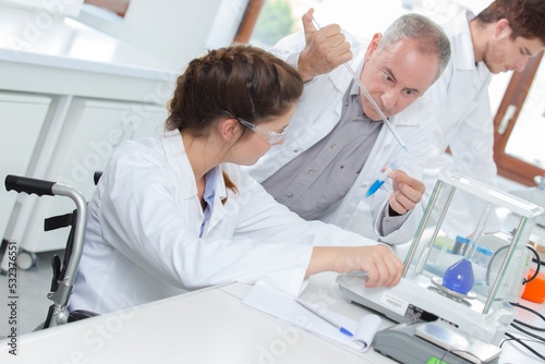 researchers carrying out experiments in a lab