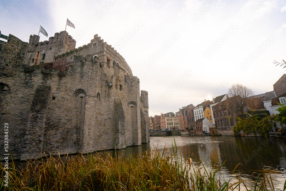 Gravensteen , medieval castle near leie river in old town of ghent dunring winter evening : Ghent , Belgium : November 30 , 2019