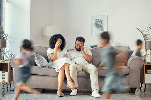 Stress, couple and family with adhd children running fast in house living room or home interior. Man, woman and parents with burnout, depression and anxiety from autism, energy and mental health kids photo