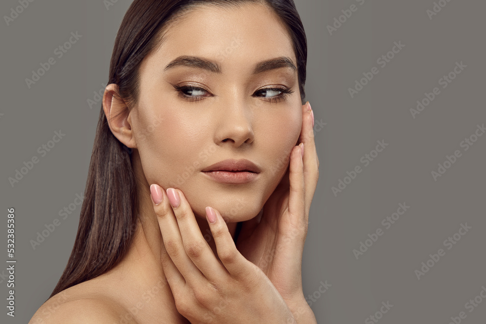 Girl touching her face with hands enjoying soft smooth skin. Girl touching her face with hands enjoying soft smooth skin.