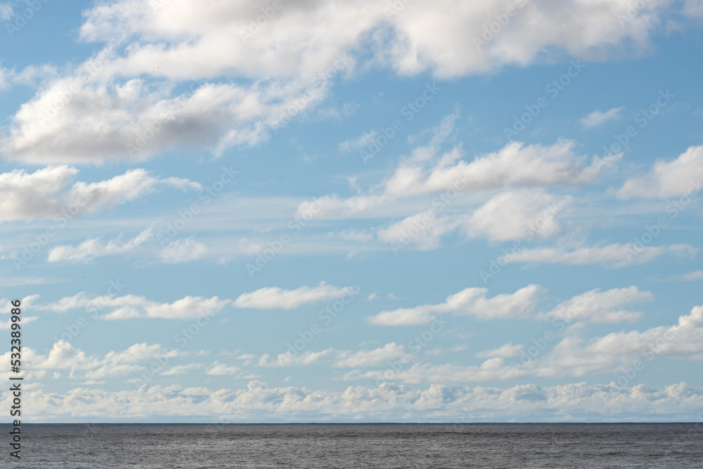 Ocean Horizon and Blue Sky with Clouds Copy Space	