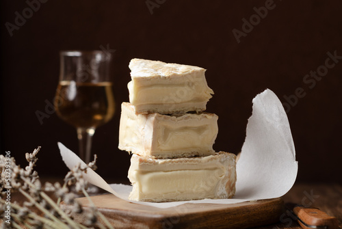 Homemade Vegan cheese on rustic black background. Copy space, close up.