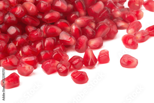 Pomegranate seeds on white