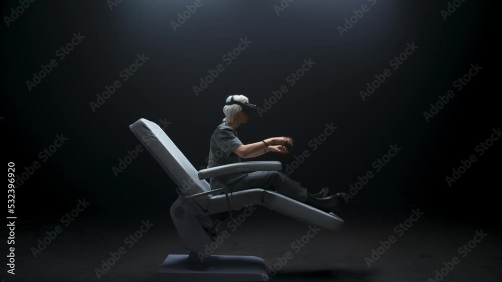 Thoughtful VR technologies user sitting exploring metaverse. Gamer playing Thoughtful VR technologies user sitting exploring metaverse. Gamer playing