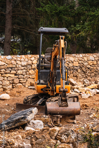 Crawler excavator standing with stone around