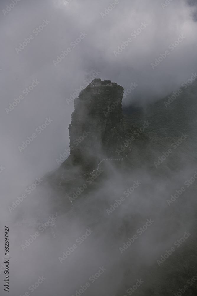 Fototapeta premium Fanjingshan in fog, Mount Fanjing Nature Reserve - Sacred Mountain of Chinese Buddhism in Guizhou, China. UNESCO World Heritage List - China National Parks, Summit View, Sea of Clouds and Peaks