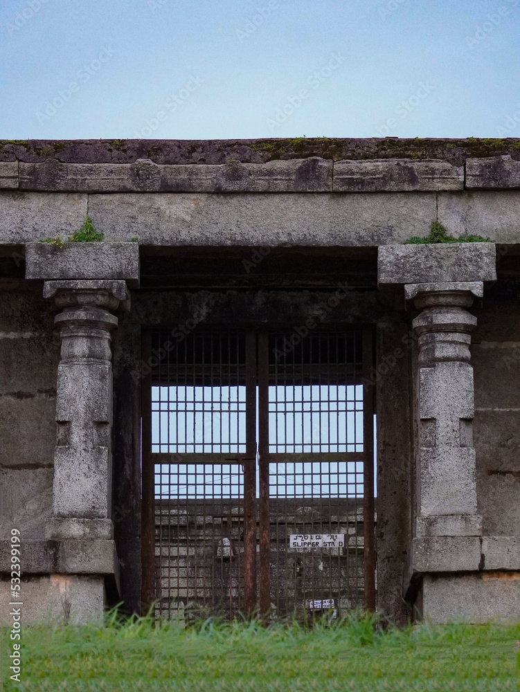 Fototapeta premium Selective focus on the wall and gate, this photo has taken from Nandi hills in India 