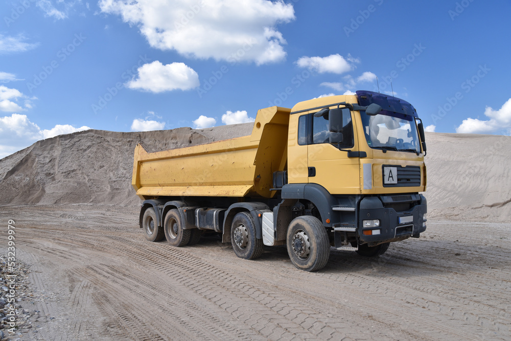 big truck transports gravel in a gravel plant