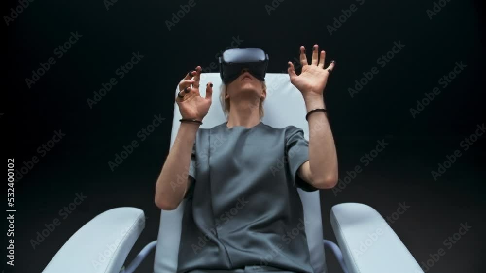 Haptic sensors hands man sitting armchair zoom out. Person exploring cyberspace Haptic sensors hands man sitting armchair zoom out. Person exploring cyberspace