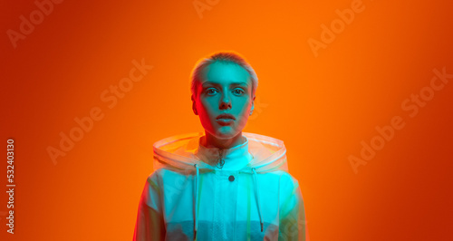 Futuristic female model under neon light photo