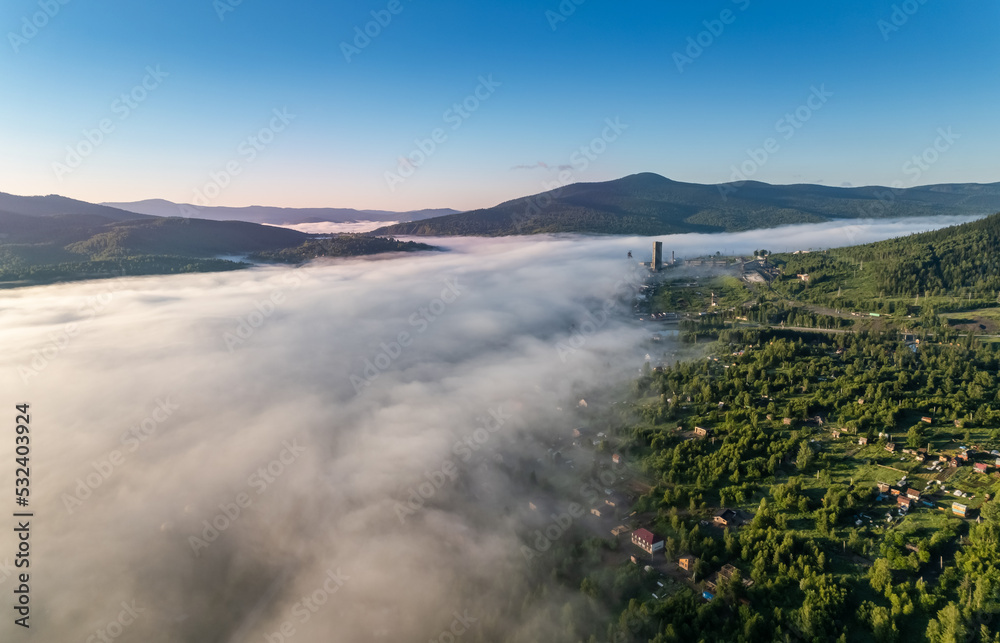 Summer city Sheregesh hotel Kemerovo region, Russia Aerial top view with fog