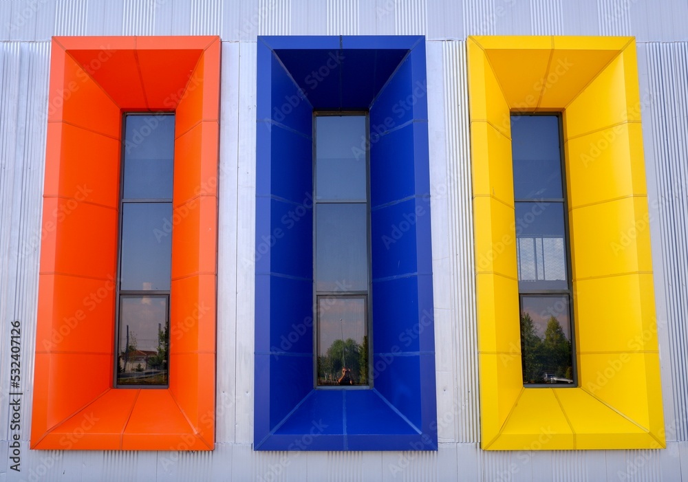 Fototapeta premium vertical colorful windows, orange, blue, yellow, frame