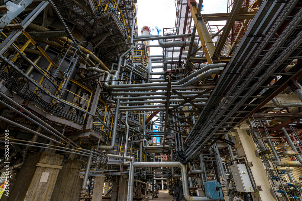 overview of metal pipes of an oil refinery outdoors