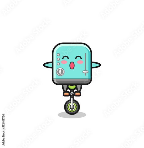The cute toaster character is riding a circus bike © heriyusuf