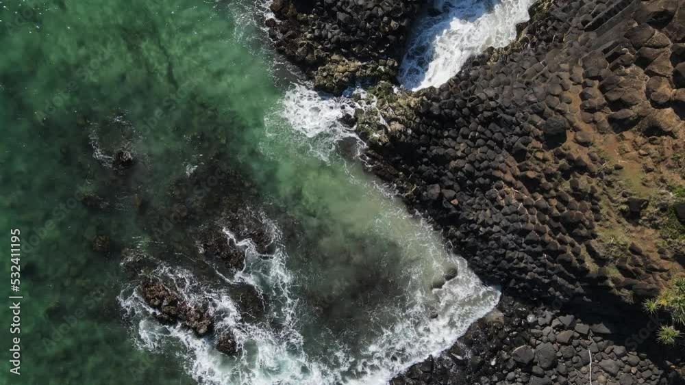 Aerial view of Fingal Heads causeway created from volcanic pillar rock pushed to the ocean surface. Drone view Aerial view of Fingal Heads causeway created from volcanic pillar rock pushed to the ocean surface. Drone view