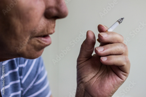 Portrait of mature woman smoke a cigarette