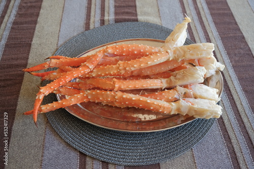 crab legs. boiled king crab legs on the plate. photo