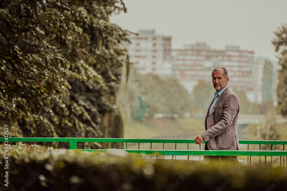 Fototapeta premium focused businessman in suit walking in urban environment.