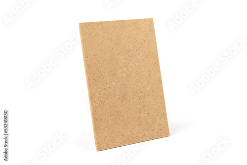 Brown cardboard sheet of paper on white background. Space for your disigne. © Olga