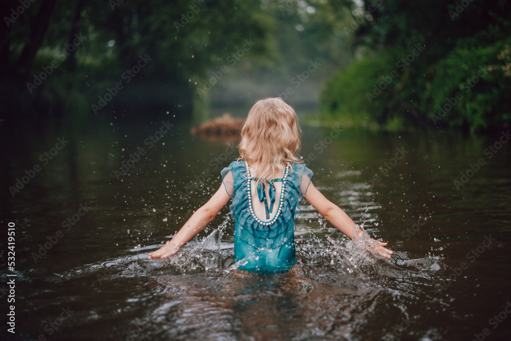 Fototapeta premium little girl in the river