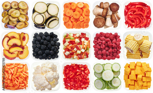 Plastic containers with chopped vegetables. Top view of raw vegetables (zucchini, carrots, bell peppers, eggplants, peaches, corn, blackberry, raspberry ) isolated on white background