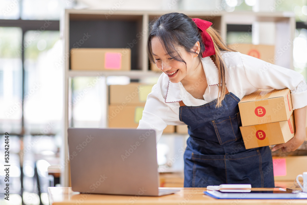 SME entrepreneur Small business entrepreneurs Online selling ideas,Happy Young Asian business owner work on computer and a boxs at home,delivery SME procurement package box deliver to customers, SME entrepreneur Small business entrepreneurs Online selling ideas,Happy Young Asian business owner work on computer and a boxs at home,delivery SME procurement package box deliver to customers,