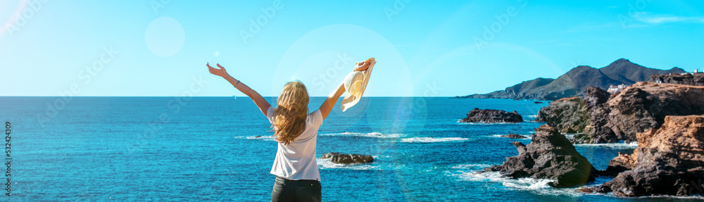 Happy woman looking mediterranean sea